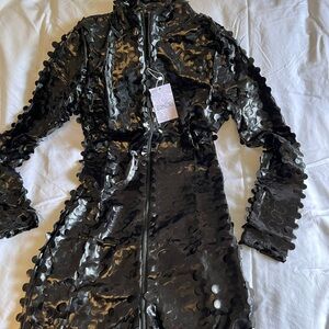 👌🏼🌺NWT jumpsuit…Synthetic material with a petal type appearance